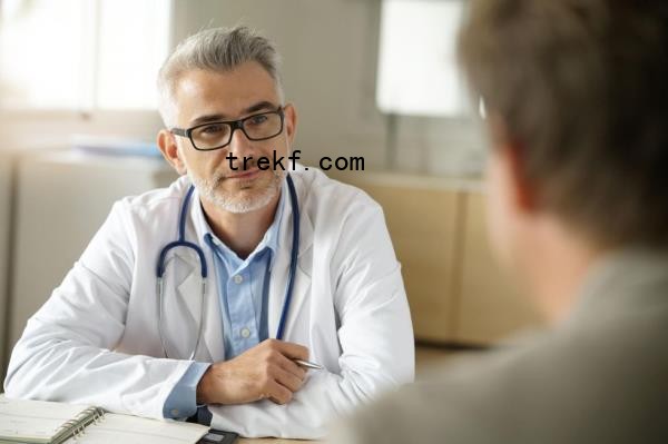 Doctor talking to male patient