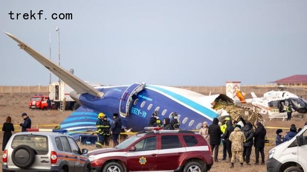 Emergency specialists work at the crash site of an Azerbaijan Airlines passenger jet near the western Kazakh city of Aktau