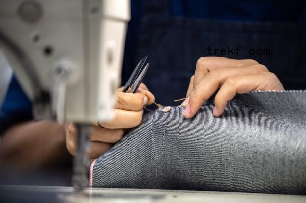 A staff member working on denim fabric at the Momotaro Jeans factory in the Kojima district of Okayama. — AFP pic 